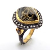 Hand-made ring with reversely engraved intaglio skull, topaz , brilliant diamonds and gold in silver