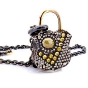 An exquisite, convertible clasp necklace embellished with gold and diamonds on silver