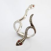 Snake ring , detailed with brilliant diamonds and 18k gold