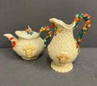 Newport pottery Teapot and jug both with fruit decorated handles