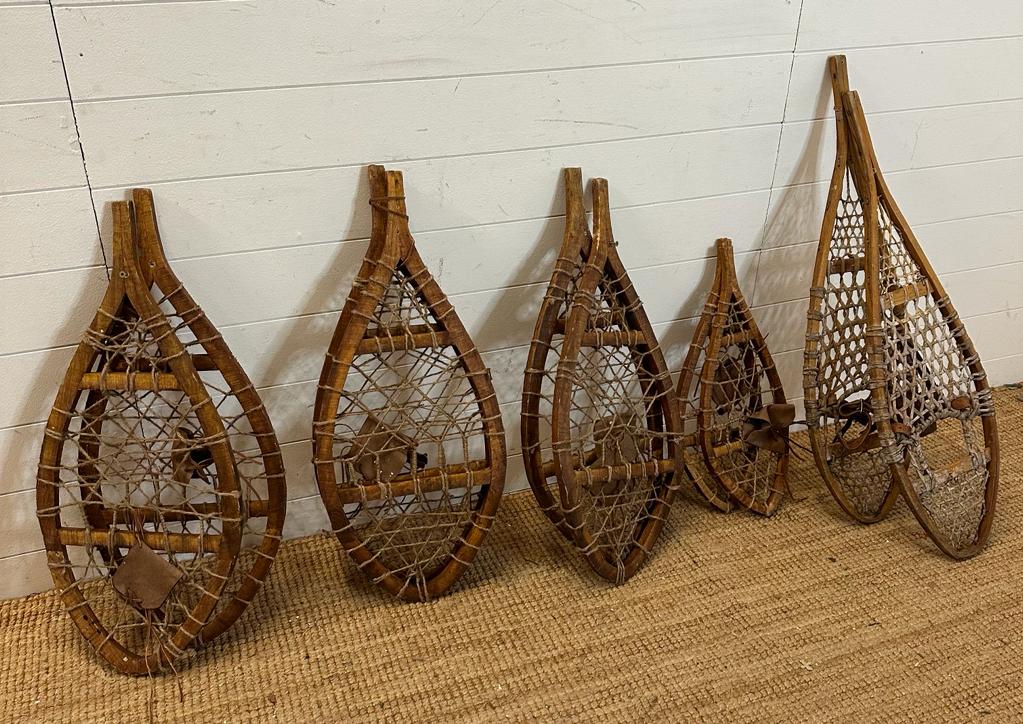 Five pairs of vintage wooden webbed snow shoes