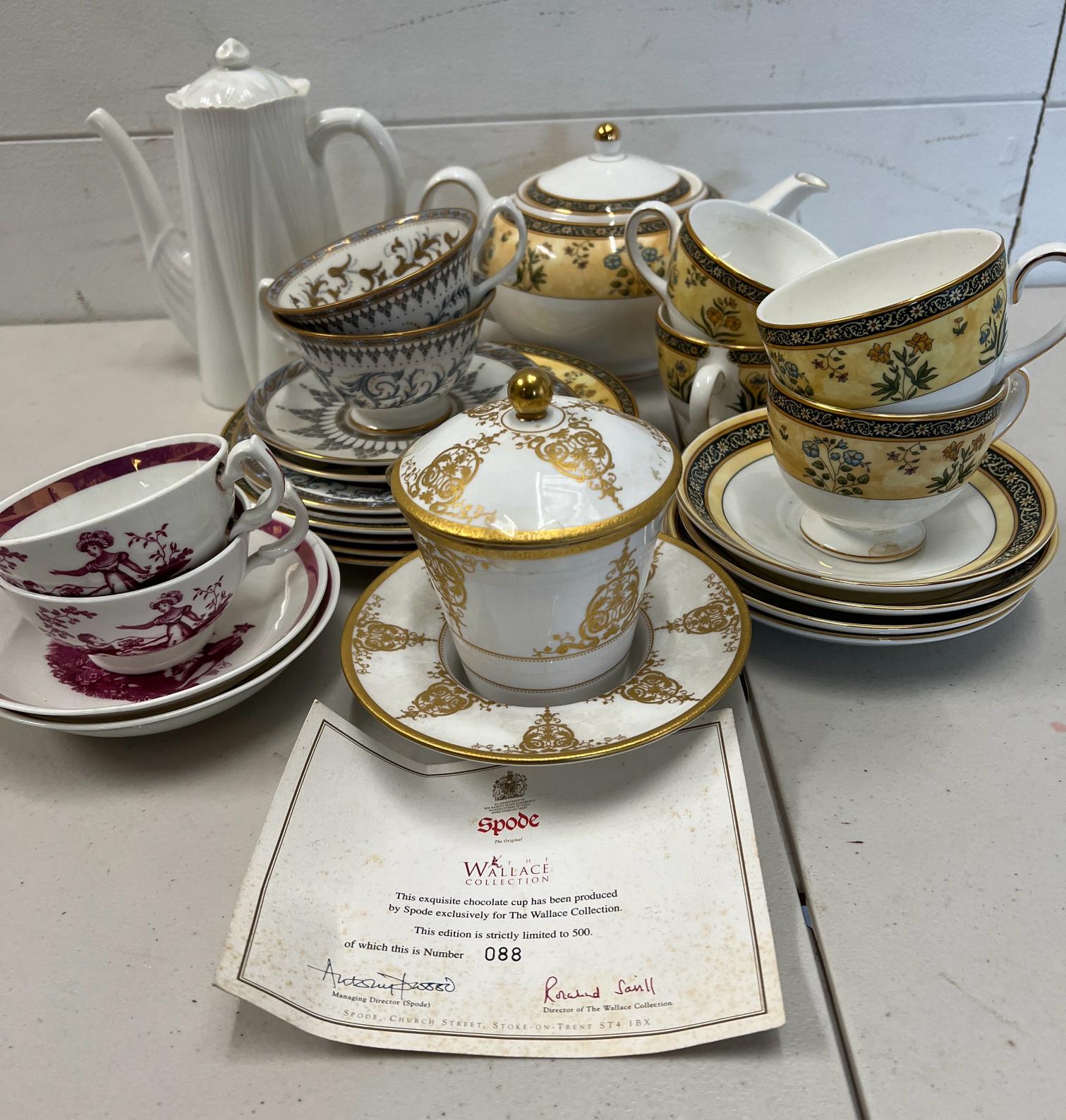 A mixed selection of china tea cups and teapots, various makers