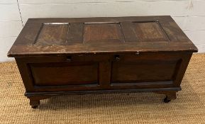 An oak two panelled coffer (H45cm W90cm D40cm)