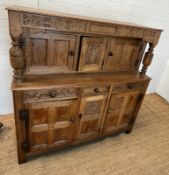 A light oak buffet court cupboard, three panelled doors top and bottom (H139cm W140cm D54cm)