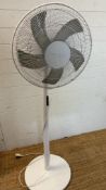 A floor standing white pedestal fan