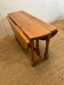 A low gate leg table (H48cm W80cm D31cm)