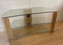 A two tier glass media unit (H52cm W100cm D41cm)
