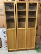 A double and single glazed bookcase/display unit
