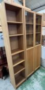 A double and single glazed bookcase/display unit