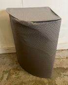 A corner laundry bin