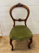 A balloon back side chair