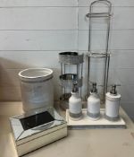 A selection of bathroom accessories including soap dispenser etc