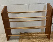 A teak Mid Century three tier wall hanging plate rack