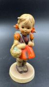 A West German Hummel Goebel figure of a school girl