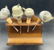 Four vintage bottle pourers