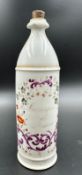 A late 19th Century French apothecary bottle, hand painted with a scrolling floral pattern