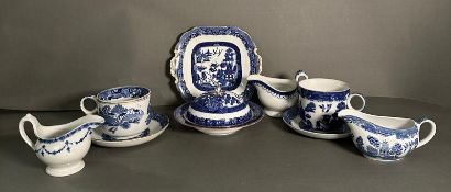 A selection of blue and white china to include large cups and saucers, sauce boats and a plate,