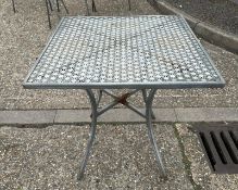 A metal starburst garden table