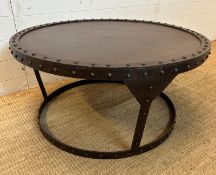 A circular industrial style coffee table with rivet detail and a raised rim (H43cm Dia91cm)