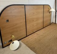 A 6ft bed with velvet divan base and sprung mattress and a wall hanging headboard