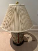 A porcelain table lamp with pattern to sides and a gazelle