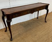 A two drawer console table with brass drop handles on cabriole legs manufactured by Hekman (H70cm