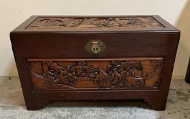 A camphor wood trunk with oriental carvings to sides and tops AF (H60cm W100cm D51cm)
