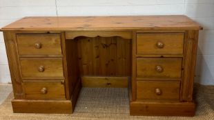 A pine dressing table flanked on both side by three drawers (D44cm W154cm H76cm)
