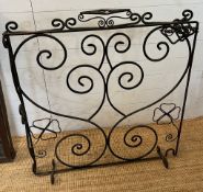 A wrought iron fire screen 98cm x 102cm