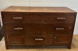 An oak sideboard with two long drawers over one central drawer flanked by two cupboards AF (H74cm