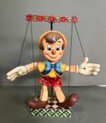 A boxed wooden Disney puppet of Pinocchio