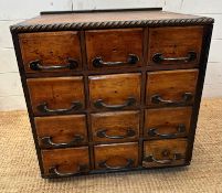 An industrial style bank of drawers (H50cm W52cm D51cm)