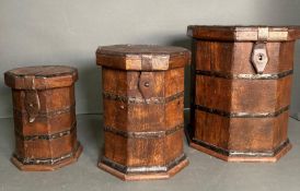 A set of three graduated boxes, metal bound, hexagonal in shape, the largest 31cm H