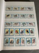 Two albums of mint and used World stamps on bird stamps theme various countries and denominations to