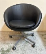 An Ikea faux black leather leather adjustable office tub chair on castor