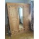 A pine wardrobe comprising of central mirrored door flanked by two panel doors with three drawers - Image 1 of 6