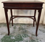 A mahogany ladies desk or writing table with hinged lid opening to black leather writing surface and