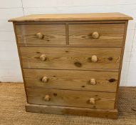 A pine chest of drawers, two over three (H92cm W90cm D45cm)