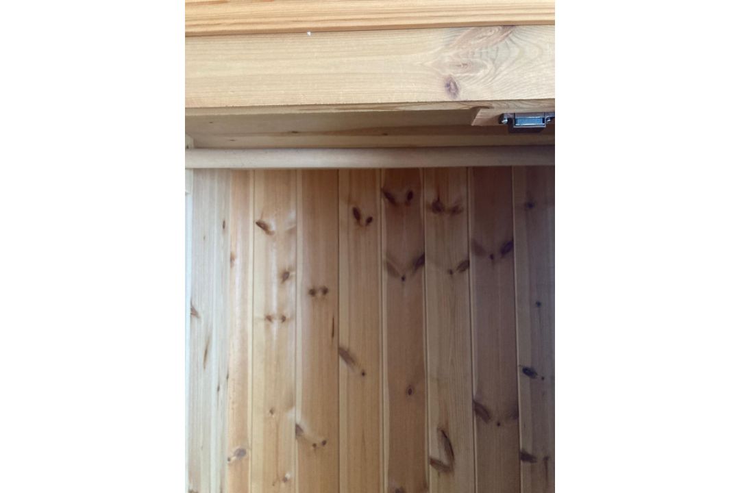 A pine wardrobe comprising of central mirrored door flanked by two panel doors with three drawers - Image 5 of 6