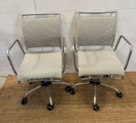 Two chrome office chairs on castors