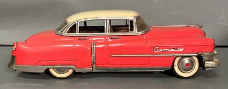 A Gama 300 tinplate 1950's friction powered Cadillac in pink