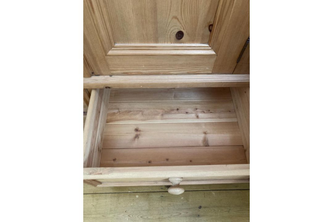 A pine wardrobe comprising of central mirrored door flanked by two panel doors with three drawers - Image 4 of 6