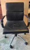An Eames style leather office chair