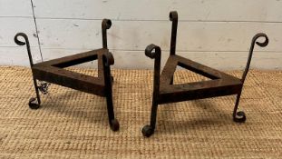 A pair of wrought iron triangular plant stands