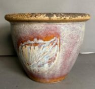 A grey ground glazed garden plant pot with leaf decorations
