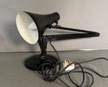 A black Anglepoise lamp