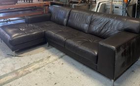 A brown leather corner sofa on chrome legs (256cm x 160cm)