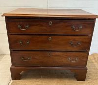 A mahogany George III style chest of drawers comprising of three long drawers with brass back