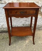 A side table with drawer to centre on out swept legs (H68cm W44cm D30cm)