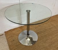 A glass and chrome circular table (H73cm Dia80cm_